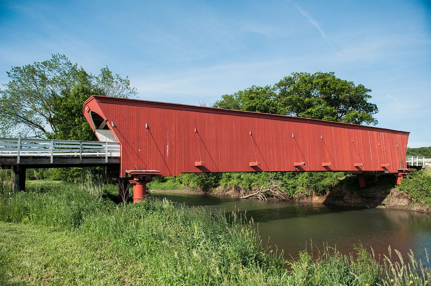 The Hogback Bridge, a red covered bridge spanning the North River in Madison County, Iowa